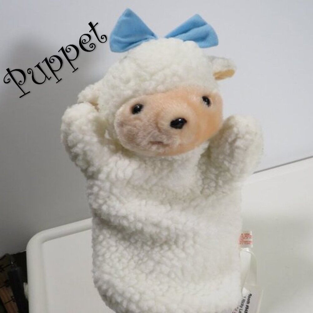 vintage sheep puppet with blue bow sewn on, lined inside thick heavy fur fabric